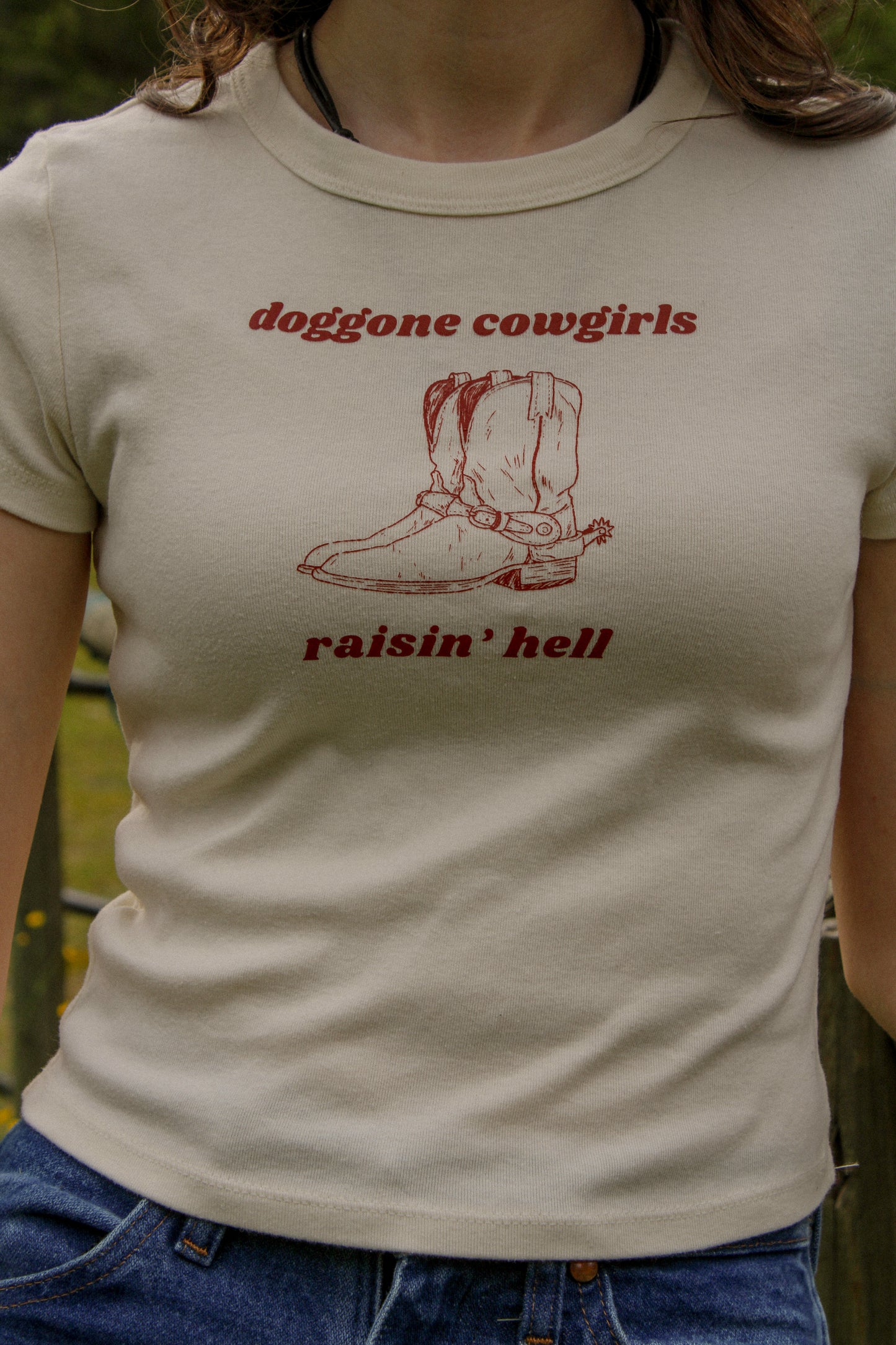 Doggone Cowgirl raisinâ hell baby tee