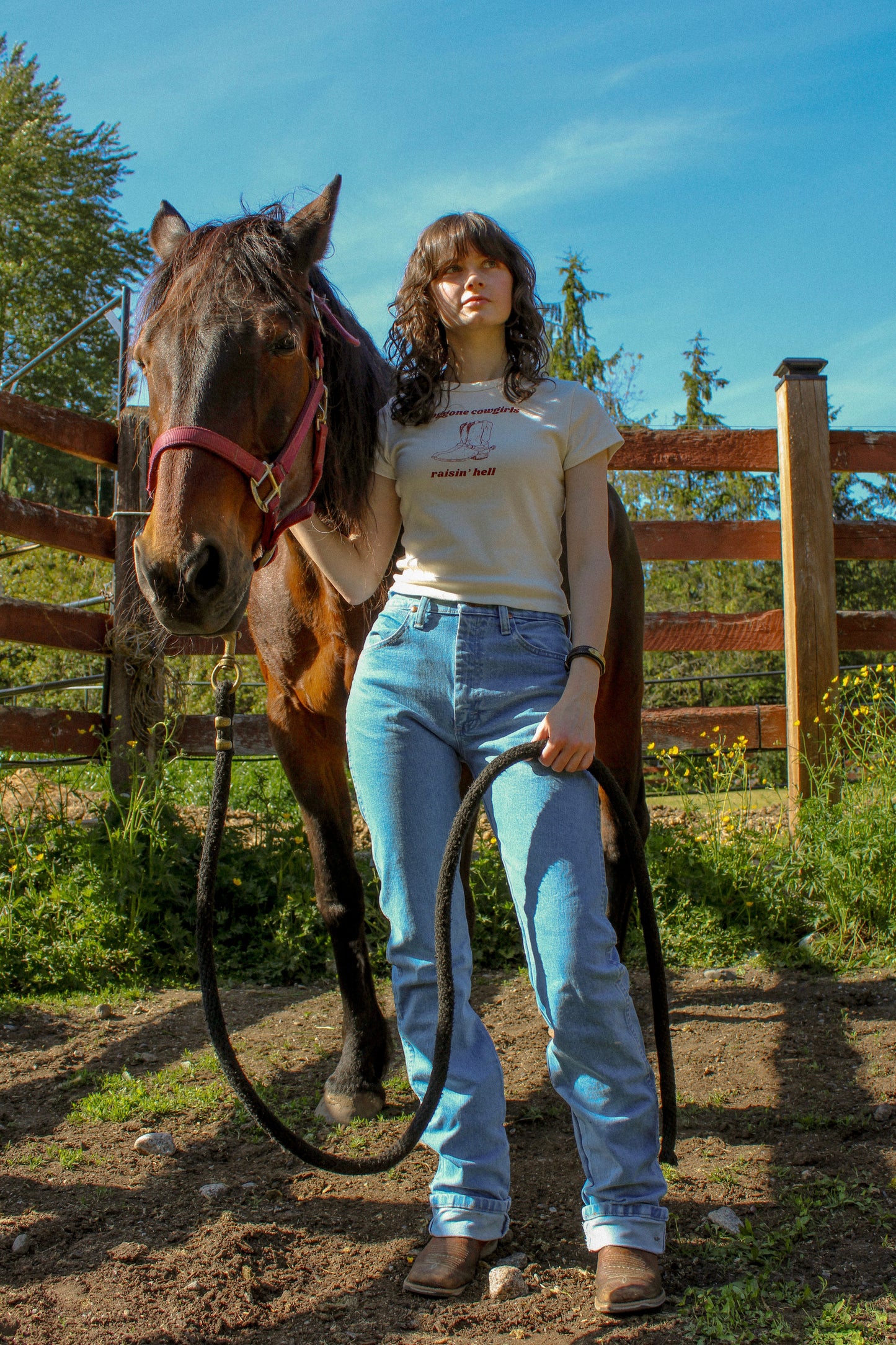 Doggone Cowgirl raisinâ hell baby tee