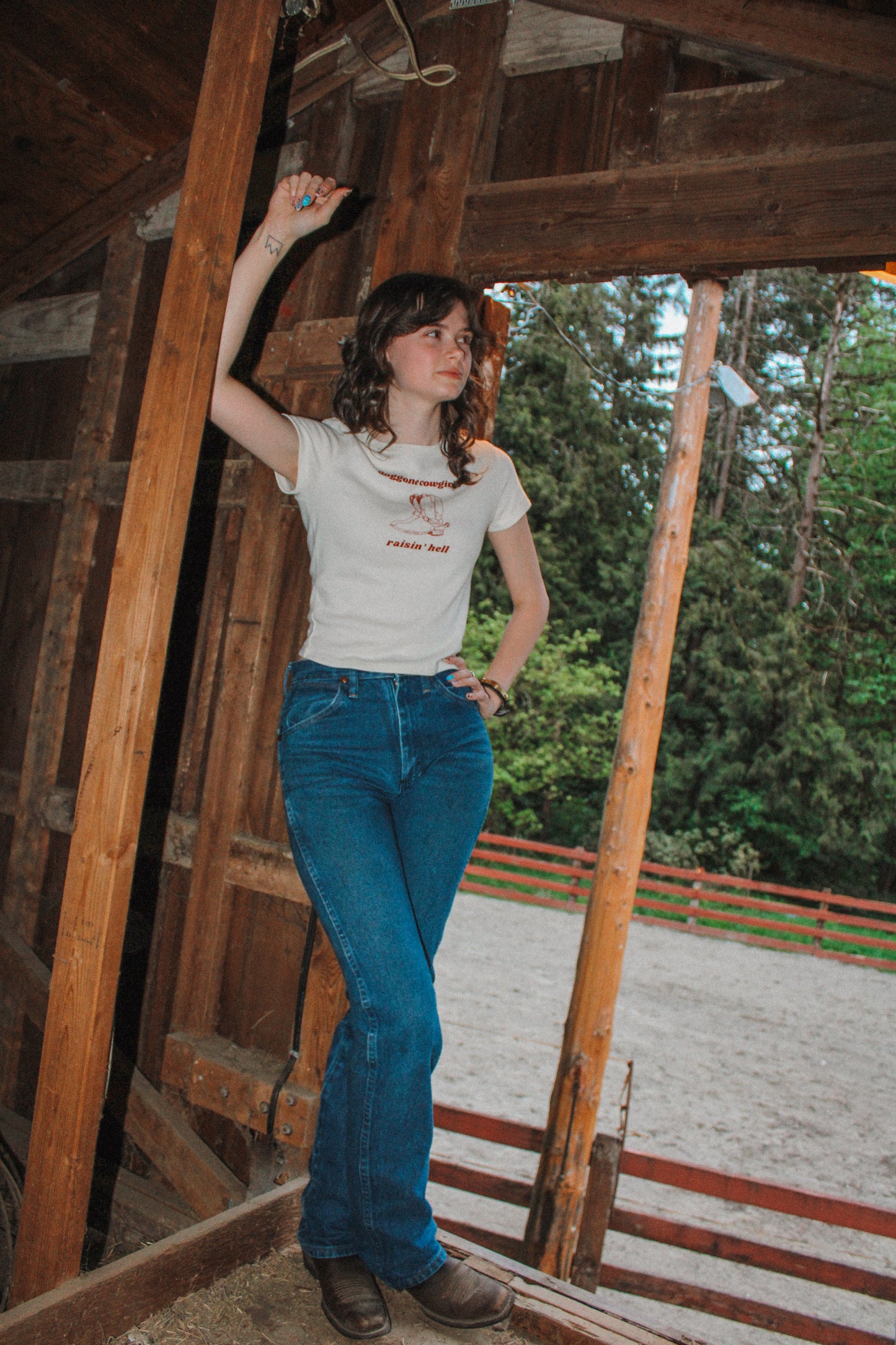 Doggone Cowgirl raisinâ hell baby tee